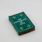 Book-shaped dog toy titled 'The Psychology of Cats'